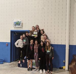 Hellgates Girls 2020 State Swim Team, holding their 2nd place plaque at the conclusion of the meet. Photo courtesy of Addy Lewis.