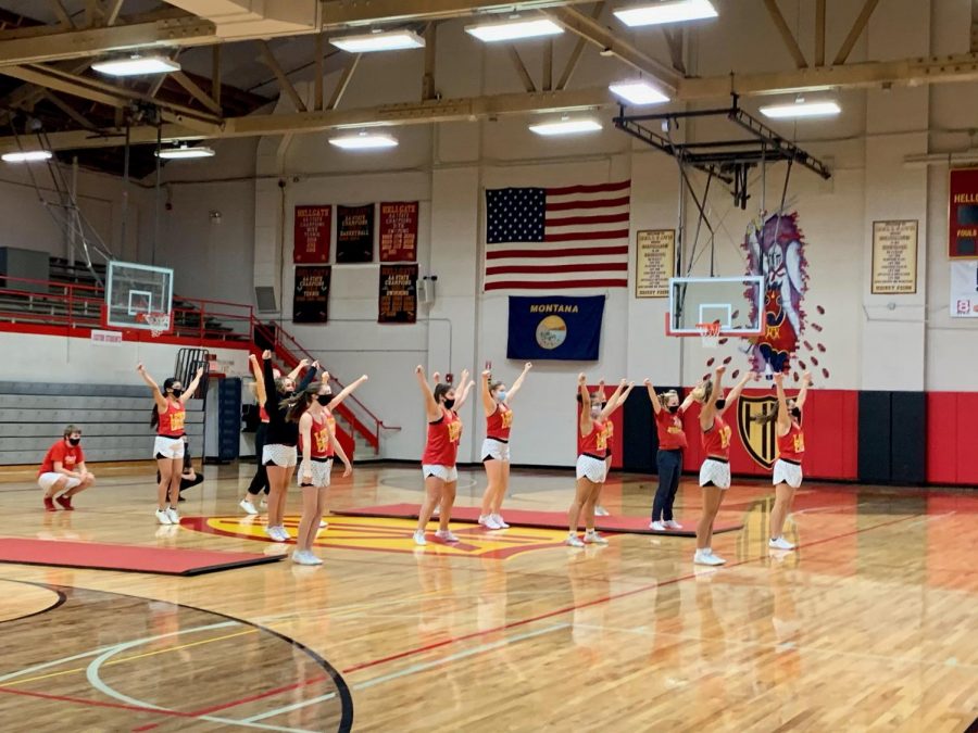 The cheerleaders rehearse their competition routine at practice before school.