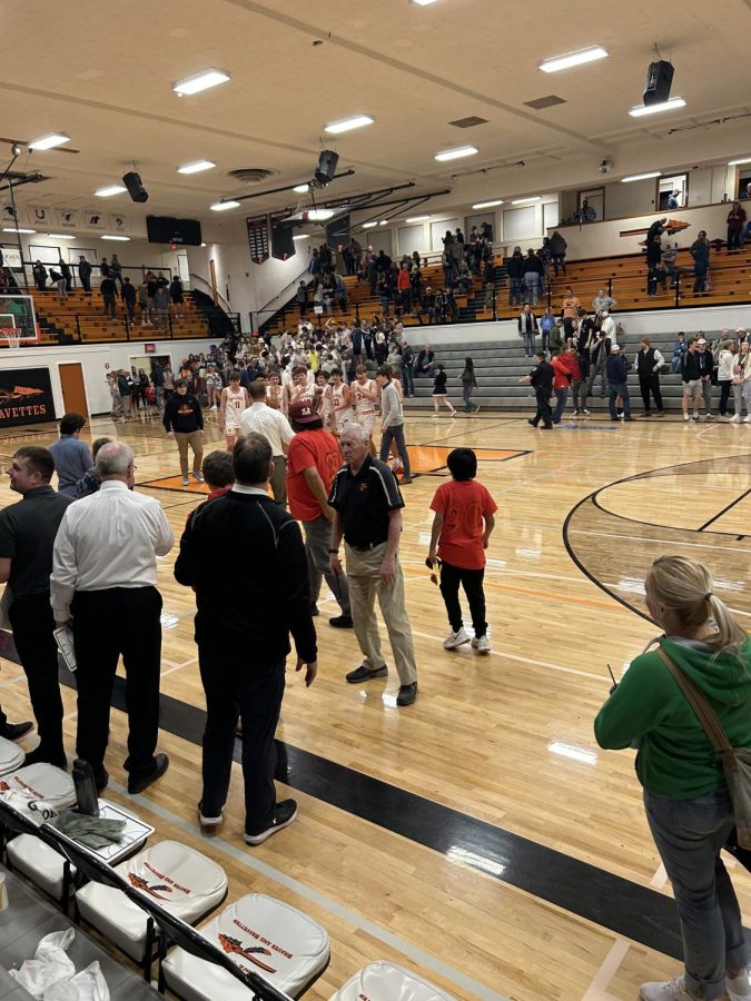 Hellgate boys and parents celebrate their 57-33 win over Kalispell Glacier on Sarturday night at Flathead High School.