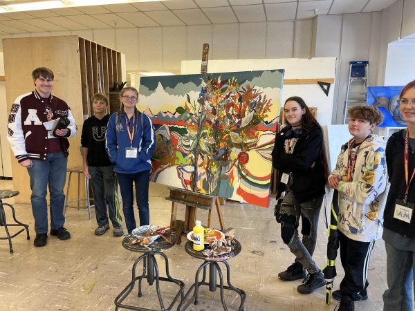 Montana high school students pose next to artwork created during workshop in Montana Art Interscholastic. Photo courtesy of University of Montana Art Department.