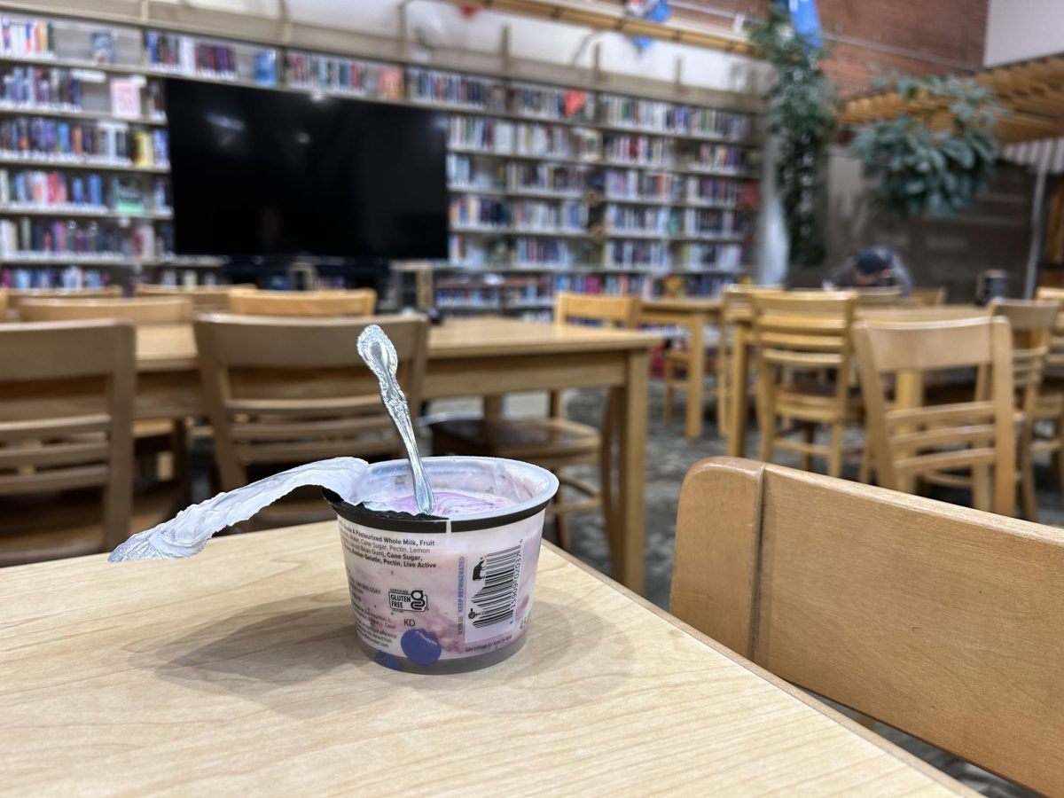 An unlawful yogurt sitting amongst the tables in Hellgates library. Photo by Will Hansen.