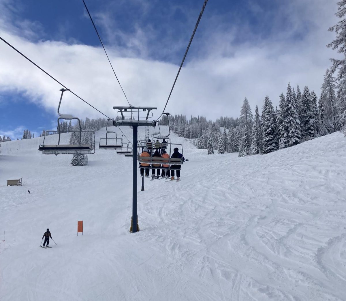 Blue skis above the early season slopes. Photo by Will Hansen.