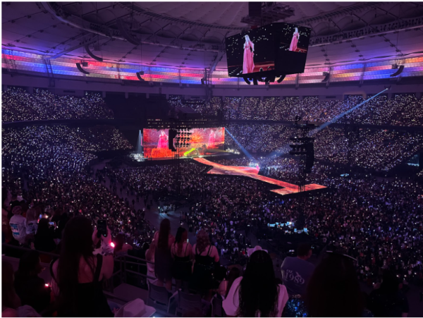 Taylor Swift performing in the Folk-more era during her last performance of the Eras Tour in Vancouver, Canada