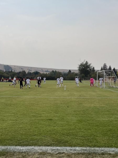 Hellgate boys varsity on a corner kick against Butte. Photo by Mai McKelvey-Pham. 